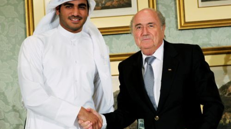 PK 2022 komitejas Hamads Al-Thani un FIFA prezidents Zeps Blaters 
Foto:AP/Scanpix