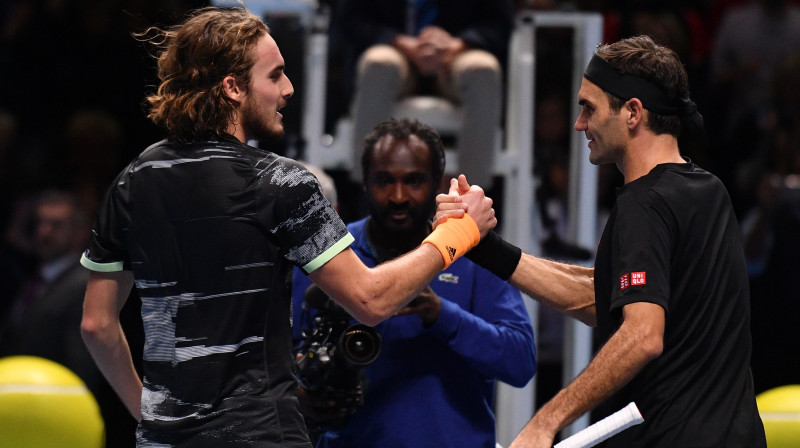 Stefanoss Cicipass un Rodžers Federers. Foto: AFP/Scanpix